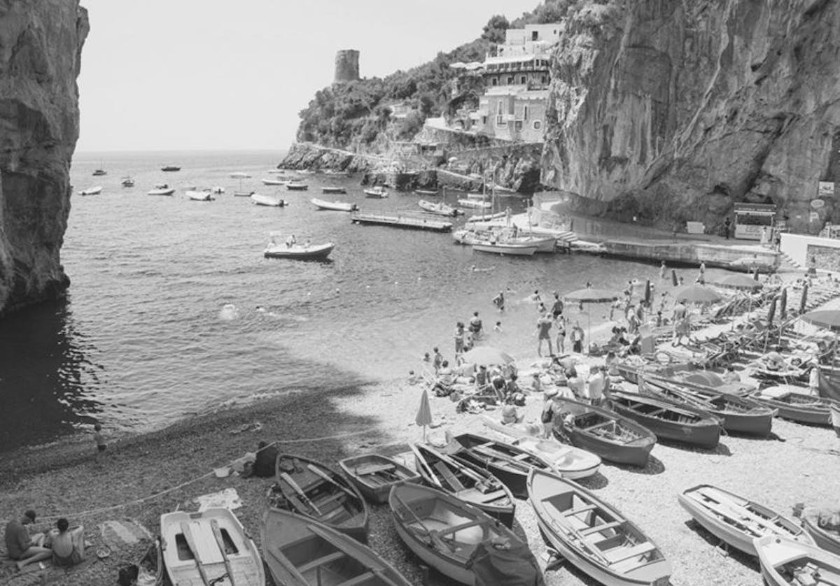 a group of people on a rocky beach